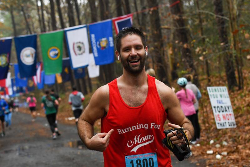 Griff running a race in a Running For Mom shirt